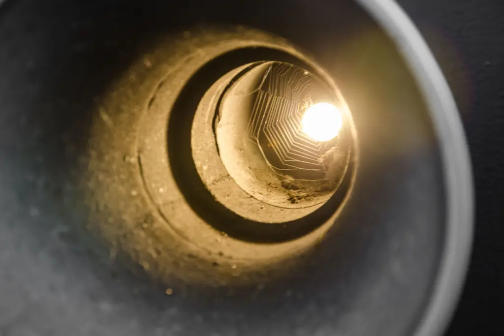 Light at the far end of a pipe, seen from inside the line.